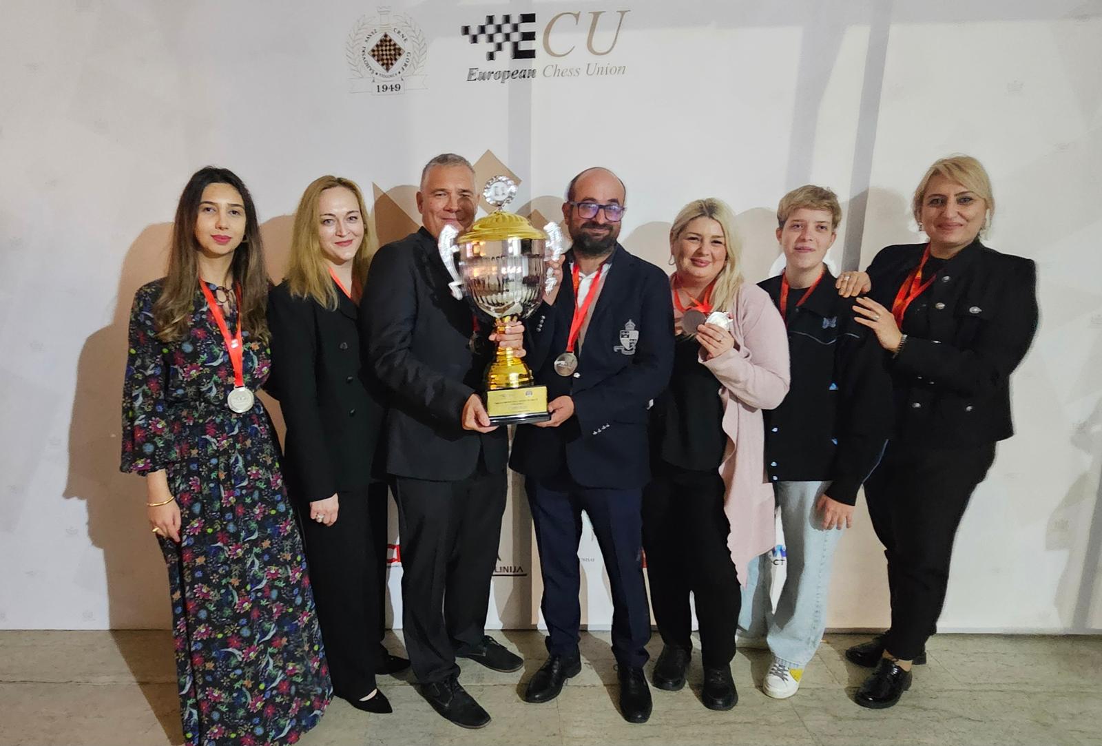Gambit Bonnevoie’s women, coach and captain, and club president with the silver trophy in Budva.